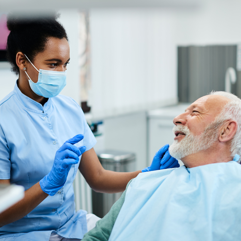 dental assistant and patient